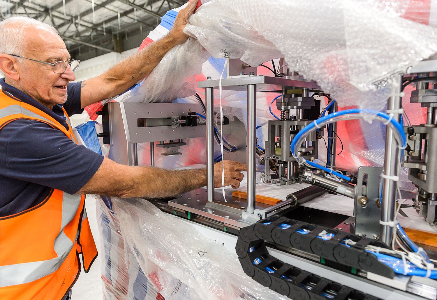 Machines being unpacked at new mask manufacturing facility in Brompton